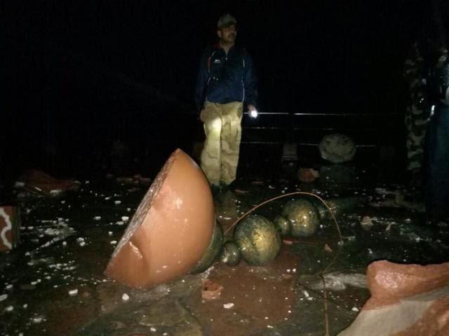 A broken dome and brass filial lies in front of the royal gate of the Taj Mahal on Wednesday night. (Raju Tomar/HT Photo) A broken dome and brass filial lies in front of the royal gate of the Taj Mahal on Wednesday night. (Raju Tomar/HT Photo)