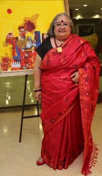 Artist and art curator Alka Raghuvanshi with her artwork that is strongly influenced by movement in dance.