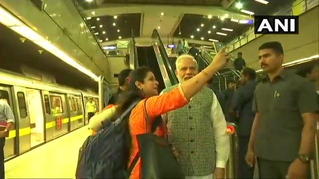 PM Modi stopped to take a selfie with a commuter before boarding the metro at Lok Kalyan Marg station, in New Delhi on Friday. (ANI/Twitter) PM Modi stopped to take a selfie with a commuter before boarding the metro at Lok Kalyan Marg station, in New Delhi on Friday. (ANI/Twitter)