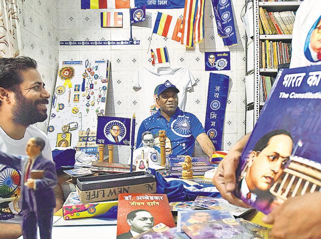 Anuj Kumar, a shopkeeper, sells Bhimrao Ambedkar merchandise in Shahdara. (Raj K Raj/HT Photo) Anuj Kumar, a shopkeeper, sells Bhimrao Ambedkar merchandise in Shahdara. (Raj K Raj/HT Photo)