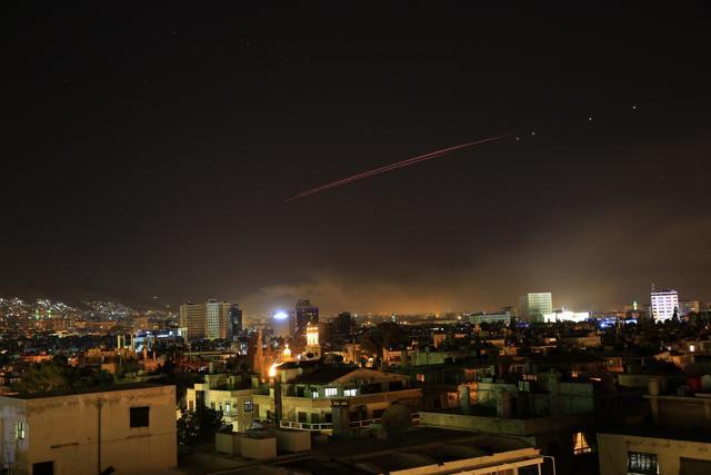Damascus skies erupt with anti-aircraft fire as the US launches an attack on Syria targeting different parts of the Syrian capital Damascus. (AP Photo)