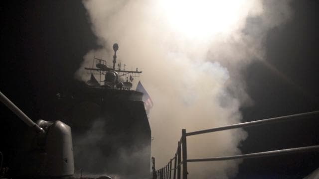 Smoke rises as the U.S. Navy guided-missile cruiser USS Monterey fires Tomahawk land attack missiles in this still image from Pentagon's video released on April 14, 2018 (REUTERS) Smoke rises as the U.S. Navy guided-missile cruiser USS Monterey fires Tomahawk land attack missiles in this still image from Pentagon's video released on April 14, 2018 (REUTERS)