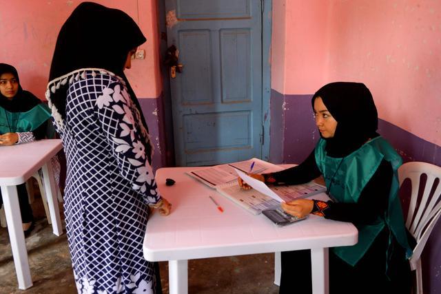 This photo taken on April 14, 2018 shows an Afghan employee of the Independent Election Commission (IEC) registering a resident at a voter registration center for the upcoming parliamentary and district council elections in Kabul. (AFP) This photo taken on April 14, 2018 shows an Afghan employee of the Independent Election Commission (IEC) registering a resident at a voter registration center for the upcoming parliamentary and district council elections in Kabul. (AFP)