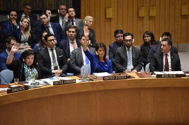 British Ambassador to the UN Karen Pierce (L) and US Ambassador to the UN Nikki Haley (C) vote during a UN Security Council meeting, at the United Nations Headquarters in New York, on April 14, 2018. (AFP) British Ambassador to the UN Karen Pierce (L) and US Ambassador to the UN Nikki Haley (C) vote during a UN Security Council meeting, at the United Nations Headquarters in New York, on April 14, 2018. (AFP)
