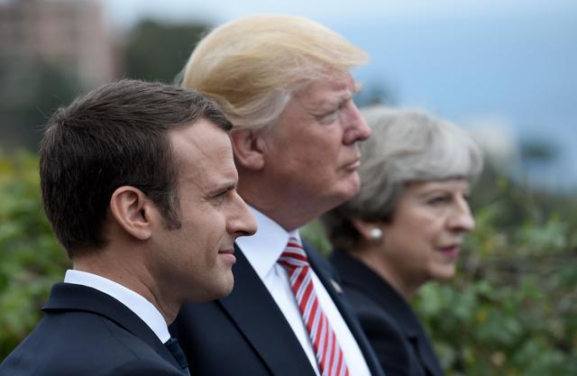 This file photo taken on May 26, 2017 shows (left-right) French President Emmanuel Macron, US President Donald Trump and Britain's Prime Minister Theresa May in Taormina, Sicily. (AFP Photo) This file photo taken on May 26, 2017 shows (left-right) French President Emmanuel Macron, US President Donald Trump and Britain's Prime Minister Theresa May in Taormina, Sicily. (AFP Photo)