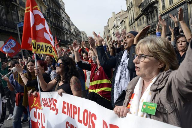 Protesters take part in a march called " Stop Macron!" to protest against planned reforms of the French government in Marseille, southern France, on April 14, 2018. (AFP) Protesters take part in a march called " Stop Macron!" to protest against planned reforms of the French government in Marseille, southern France, on April 14, 2018. (AFP)