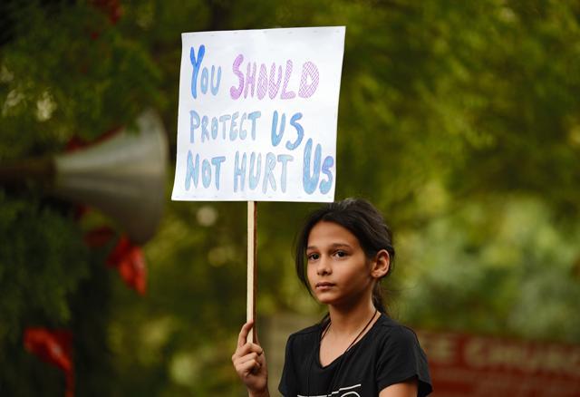 A demonstrator holds a placard during a silent protest 'Not In My Name' in support of rape victims following high profile cases in Jammu and Kashmir and Uttar Pradesh states, in New Delhi. (AFP ) A demonstrator holds a placard during a silent protest 'Not In My Name' in support of rape victims following high profile cases in Jammu and Kashmir and Uttar Pradesh states, in New Delhi. (AFP )