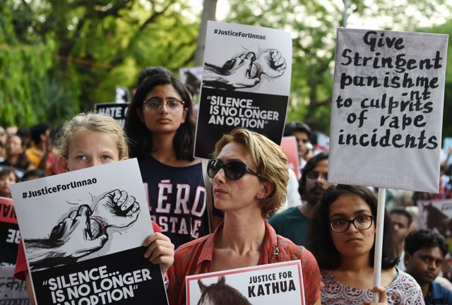 Demonstrators hold placards during a silent protest 'Not In My Name', in New Delhi. (AFP ) Demonstrators hold placards during a silent protest 'Not In My Name', in New Delhi. (AFP )
