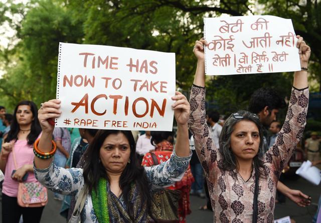 Women hold placards during a silent protest in New Delhi. (AFP Photo) Women hold placards during a silent protest in New Delhi. (AFP Photo)
