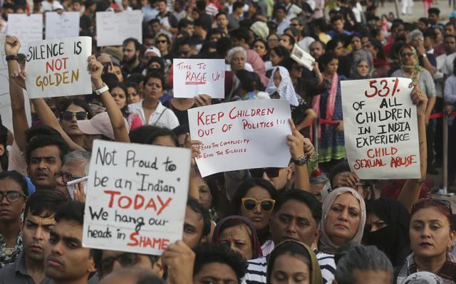 People hold placards during a protest against recent incidents of rape in the country, in Mumbai. Violent crimes against women have been on the rise despite tough laws enacted in 2013. (AP Photo) People hold placards during a protest against recent incidents of rape in the country, in Mumbai. Violent crimes against women have been on the rise despite tough laws enacted in 2013. (AP Photo)