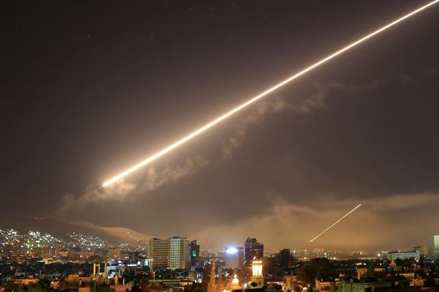 Damascus skies erupt with service to air missile fire as the US launches an attack on Syria targeting different parts of the Syrian capital on Saturday. (AP) Damascus skies erupt with service to air missile fire as the US launches an attack on Syria targeting different parts of the Syrian capital on Saturday. (AP)