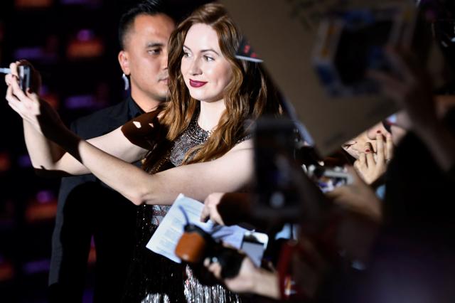 Karen Gillan takes a selfie with fans on the red carpet during a fan event for Marvel Studio's Avengers: Infinity War movie. (REUTERS)