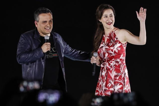 Film director Joe Russo and executive producer Trinh Tran greet fans during Marvel's Avengers: Infinity War red carpet fan event in Singapore. (AP)