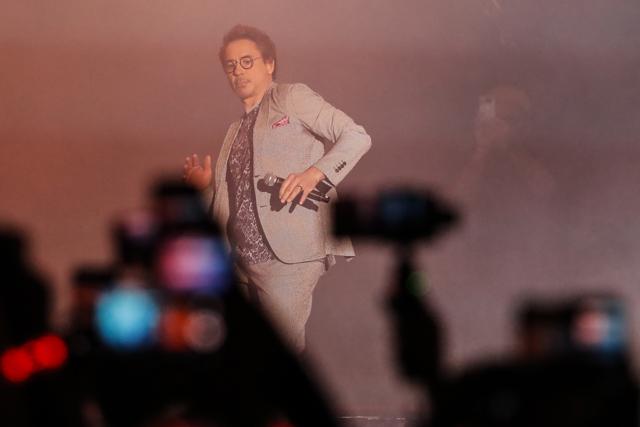 Robert Downey Jr. dances on stage upon arrival at the Marvel's Avengers: Infinity War red carpet fan event in Singapore. (AP)