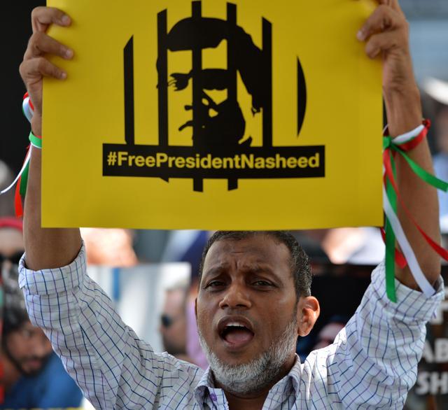 A supporter of former Maldivian president Mohamed Nasheed shouts slogans during a protest against the current Maldives President Abdulla Yameen, demanding the release of opposition political prisoners in front of the Maldives embassy in Colombo on March 6, 2018. (AFP) A supporter of former Maldivian president Mohamed Nasheed shouts slogans during a protest against the current Maldives President Abdulla Yameen, demanding the release of opposition political prisoners in front of the Maldives embassy in Colombo on March 6, 2018. (AFP)