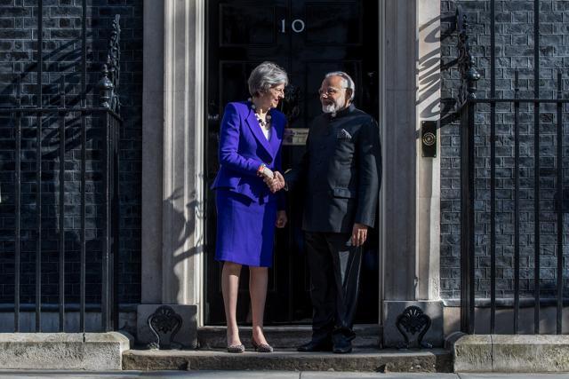 Theresa May, British prime minster (left), greets Narendra Modi outside number 10 Downing Street in London, UK, on April 18, 2018. (Bloomberg) Theresa May, British prime minster (left), greets Narendra Modi outside number 10 Downing Street in London, UK, on April 18, 2018. (Bloomberg)
