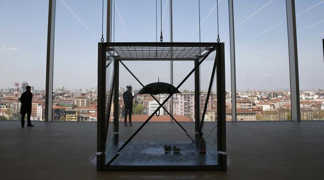 A Damien Hirst installation featuring an umbrella and floating rubber ducks on the 8th floor can be viewed against the backdrop of the city. (AP)