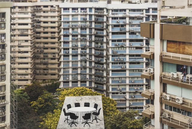 Wall-to-wall photographs show a hive of office buildings in Nariman Point. These worn-out facades are accentuated by grubby air-conditioner ducts and blinds down to shut out all sight of the natural world. (Photo courtesy Anil Rane , Chemould Prescott Road and the artist ) Wall-to-wall photographs show a hive of office buildings in Nariman Point. These worn-out facades are accentuated by grubby air-conditioner ducts and blinds down to shut out all sight of the natural world. (Photo courtesy Anil Rane , Chemould Prescott Road and the artist )