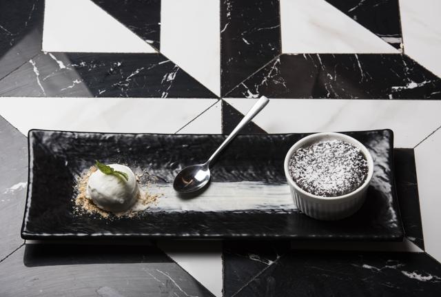 The molten Belgian chocolate fondant, with a light crust that opens up to a centre of thick, dark, slightly bitter chocolate, is a must-try. (Aalok Soni / HT Photo)