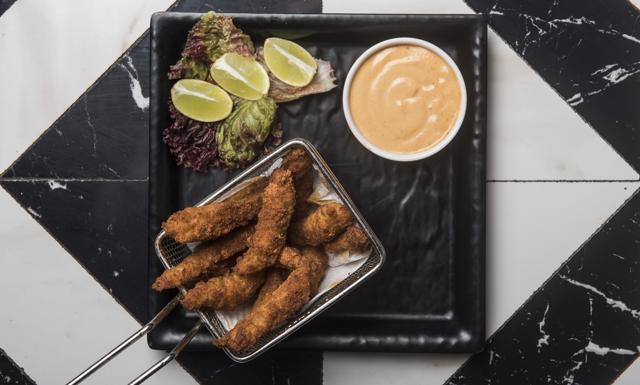 The peri peri fish fingers were crispy and piquant, coated in a lovely thick crust. (Aalok Soni / HT Photo)