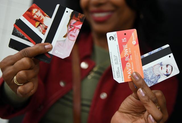 A woman holds up keepsake MetroCards available for purchase inside the Broadway-Lafayette station, showing one of five David Bowie images including Ziggy Stardust, Aladdin Sane, and Thin White Duke. (AFP) A woman holds up keepsake MetroCards available for purchase inside the Broadway-Lafayette station, showing one of five David Bowie images including Ziggy Stardust, Aladdin Sane, and Thin White Duke. (AFP)