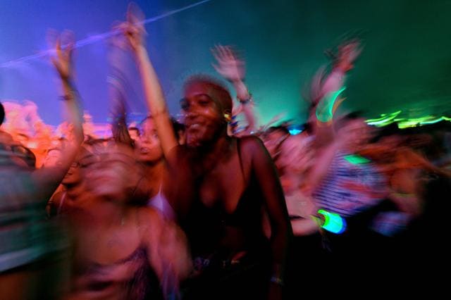People dance as Swedish DJ, remixer, record producer and singer, Tim Bergling, better known by his stage name 'Avicii', performs on the main stage of the Sziget music festival. (AFP) People dance as Swedish DJ, remixer, record producer and singer, Tim Bergling, better known by his stage name 'Avicii', performs on the main stage of the Sziget music festival. (AFP)