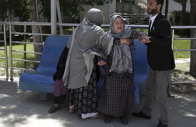 A woman shouts and cries at a hospital after she lost her son in a suicide attack on a voter registration center in Kabul, Afghanista. (AP Photo) A woman shouts and cries at a hospital after she lost her son in a suicide attack on a voter registration center in Kabul, Afghanista. (AP Photo)