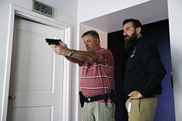 Training officer Albert Dauto, right, instructs Tom Coull at the Use of Force Training Experience. (AP) Training officer Albert Dauto, right, instructs Tom Coull at the Use of Force Training Experience. (AP)