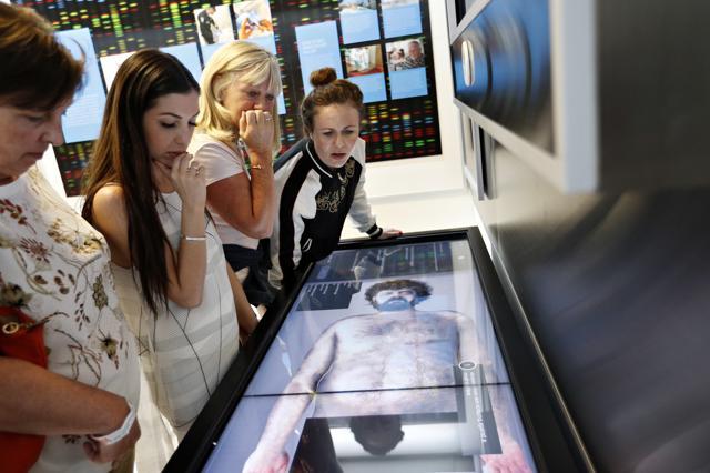 People look at an interactive exhibit at the Crime Lab Experience. (AP) People look at an interactive exhibit at the Crime Lab Experience. (AP)