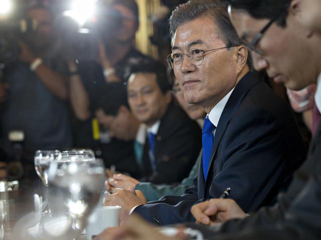 Moon Jae-in, South Korea's president, right, pauses while speaking during a meeting with House Republican and Democratic leadership in the speakers conference room at the US Capitol in Washington, DC, June 29, 2017. (Andrew Harrer/Bloomberg)