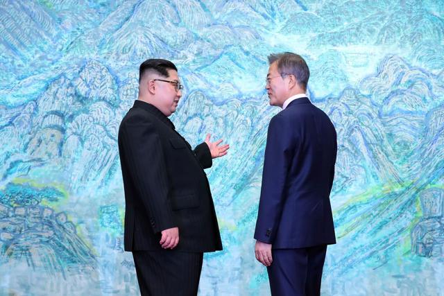 South Korea's President Moon Jae-in (R) speaks with North Korea's leader Kim Jong Un (R) during the Inter-Korean summit in the Peace House building on the southern side of the truce village of Panmunjom on April 27, 2018. (AFP) South Korea's President Moon Jae-in (R) speaks with North Korea's leader Kim Jong Un (R) during the Inter-Korean summit in the Peace House building on the southern side of the truce village of Panmunjom on April 27, 2018. (AFP)