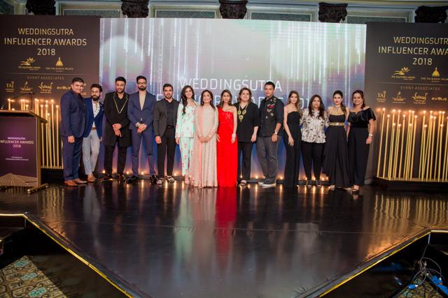 The winners and hosts at the wedding awards.