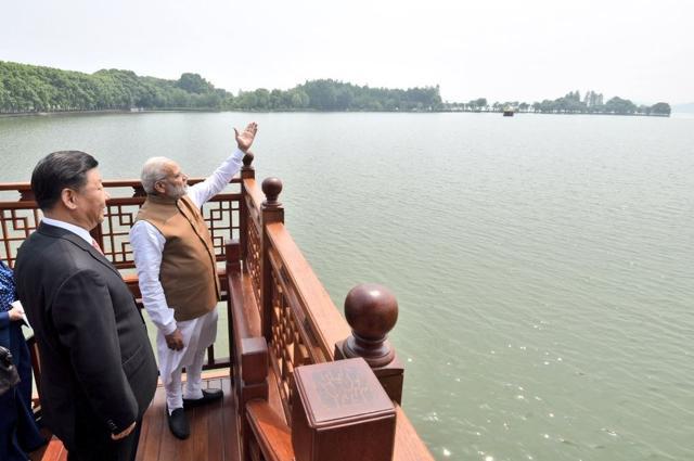 PM Modi and President Xi look out on to the East Lake in Wuhan from a boat. The lake is the second largest urban lake in China, and is where Mao Zedong’s private villa is located. Xi had hosted Modi at the villa. (PIB/Twitter)