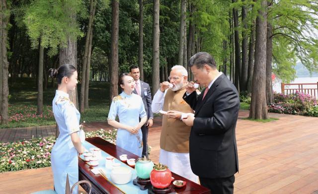 In this photo shared by the Prime Minister, Modi and Chinese president Xi Jinping have tea by the banks of the East Lake after their walk. “Productive discussions over tea. Strong India-China friendship is beneficial for the people of our nations and the entire world,” the PM captioned the image. (Narendra Modi/Twitter)