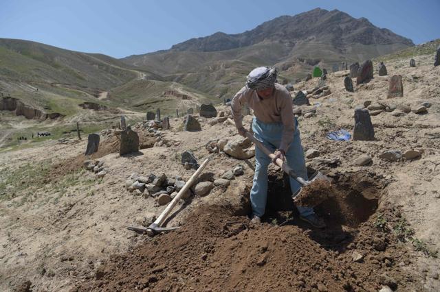 An Afghan man digs a grave for one of the 57 victims of a bomb blast before the burial a day after the attack on a voter registration centre in Kabul, on April 23, 2018. (AFP) An Afghan man digs a grave for one of the 57 victims of a bomb blast before the burial a day after the attack on a voter registration centre in Kabul, on April 23, 2018. (AFP)