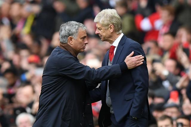 Manchester United's Portuguese manager Jose Mourinho (L) consoles Arsenal's French manager Arsene Wenger. (AFP) Manchester United's Portuguese manager Jose Mourinho (L) consoles Arsenal's French manager Arsene Wenger. (AFP)