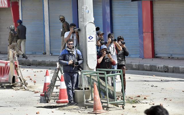 Photographers covering the protest at Amar Singh College, in Srinagar, in early April. (Ajay Aggarwal/HT PHOTO)