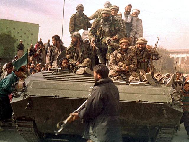 This file photo taken on November 13, 2001 shows security forces from the Northern Alliance group entering Kabul, during the fall of the Taliban regime. (Shah Marai/AFP Photo) This file photo taken on November 13, 2001 shows security forces from the Northern Alliance group entering Kabul, during the fall of the Taliban regime. (Shah Marai/AFP Photo)