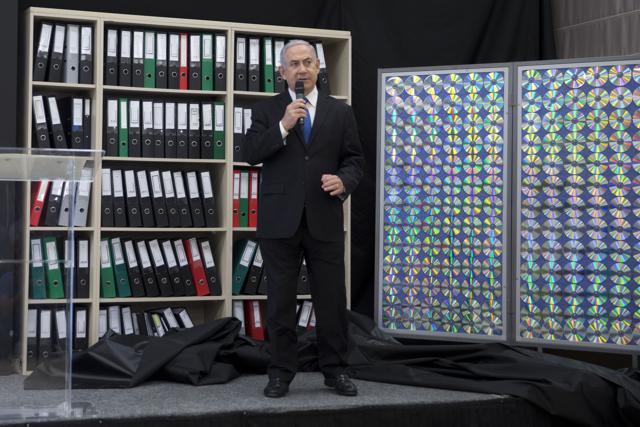 Israeli PM Benjamin Netanyahu presents material on Iranian nuclear weapons development during a press conference in in Tel Aviv on Monday. (AP) Israeli PM Benjamin Netanyahu presents material on Iranian nuclear weapons development during a press conference in in Tel Aviv on Monday. (AP)