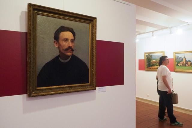 Visitors look at the painting "Le clocher de Ria" (R) (The bell tower of Ria), next to "Portrait d'un inconnu" (L) (Portrait of a stranger). (AFP) Visitors look at the painting "Le clocher de Ria" (R) (The bell tower of Ria), next to "Portrait d'un inconnu" (L) (Portrait of a stranger). (AFP)