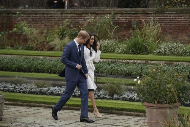Britain's Prince Harry and his fiancee Meghan Markle pose for photographers during a photocall in the grounds of Kensington Palace. (AP) Britain's Prince Harry and his fiancee Meghan Markle pose for photographers during a photocall in the grounds of Kensington Palace. (AP)