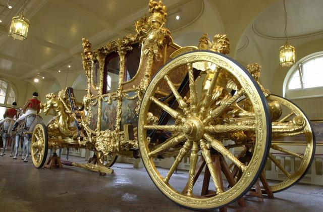 The Queen's Gold State Coach in the Royal Mews in Buckingham Palace in London. (AP) The Queen's Gold State Coach in the Royal Mews in Buckingham Palace in London. (AP)