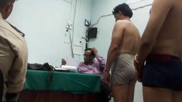 The video grab shows male police recruits with only their undergarments on in the same room where the female recruits were being examined. (HT) The video grab shows male police recruits with only their undergarments on in the same room where the female recruits were being examined. (HT)