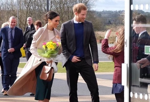 Meghan Markle and Prince Harry at a public outing. Markle must always wear stockings in public.
