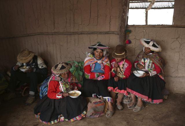 A group of Andean muleteers break for lunch during a tour guide to Rainbow Mountain. (AP) A group of Andean muleteers break for lunch during a tour guide to Rainbow Mountain. (AP)
