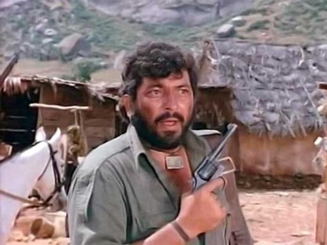 Amjad Khan as the iconic dacoit chief Gabbar Singh, in the 1975 blockbuster film Sholay. Amjad Khan as the iconic dacoit chief Gabbar Singh, in the 1975 blockbuster film Sholay.