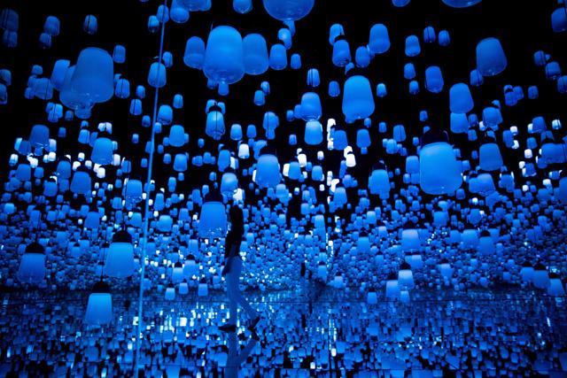 A digital installation room with hanging lamps, that illuminate as the visitor nears and the light moving from one lamp to another around the room, at Mori Building Digital Art Museum in Tokyo. (AFP) A digital installation room with hanging lamps, that illuminate as the visitor nears and the light moving from one lamp to another around the room, at Mori Building Digital Art Museum in Tokyo. (AFP)