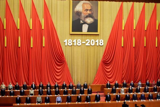 Chinese President Xi Jinping and other officials sing the national anthem at an event commemorating the 200th birth anniversary of Karl Marx, in Beijing. (Reuters Photo) Chinese President Xi Jinping and other officials sing the national anthem at an event commemorating the 200th birth anniversary of Karl Marx, in Beijing. (Reuters Photo)