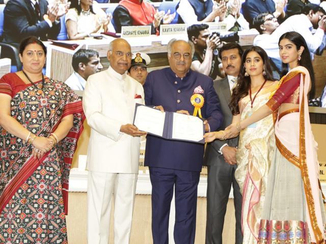 New Delhi: Filmmaker Boney Kapoor along with his daughters Janhvi and Khushi Kapoor, receives National Film Award from President Ram Nath Kovind on the behalf of his wife and late actress Sridevi. (IANS) New Delhi: Filmmaker Boney Kapoor along with his daughters Janhvi and Khushi Kapoor, receives National Film Award from President Ram Nath Kovind on the behalf of his wife and late actress Sridevi. (IANS)