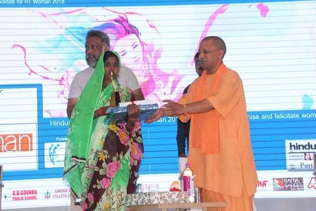 Pushpa taking award from chief minster Yogi Adityanath. (HT) Pushpa taking award from chief minster Yogi Adityanath. (HT)
